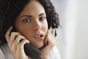 African businesswoman talking on telephone