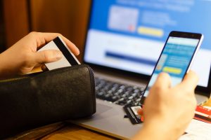women with credit card making online purchase