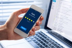 Person rating his experience with 4 stars on smartphone app 
