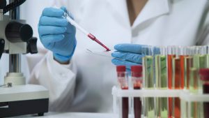 Lab technician running blood and urine test