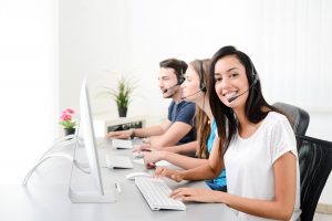 cheerful young phone customer service operators on headset 