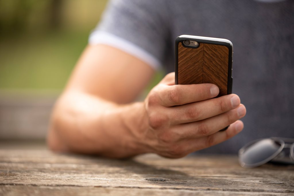 man holding his phone