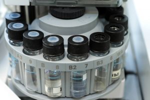 Quality Control Lab vials on autosampler medicine chromatograph 