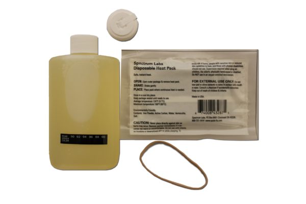 White sachet with labels, container with yellow liquid and other small things