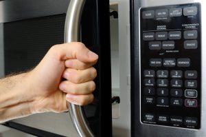 opening a microwave door