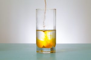 powder urine being added to water. 