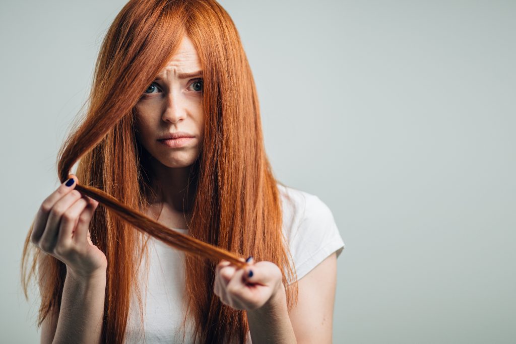 worried lady touching hair