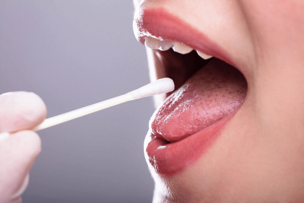 A close-up of a woman’s mouth during a mouth swab test
